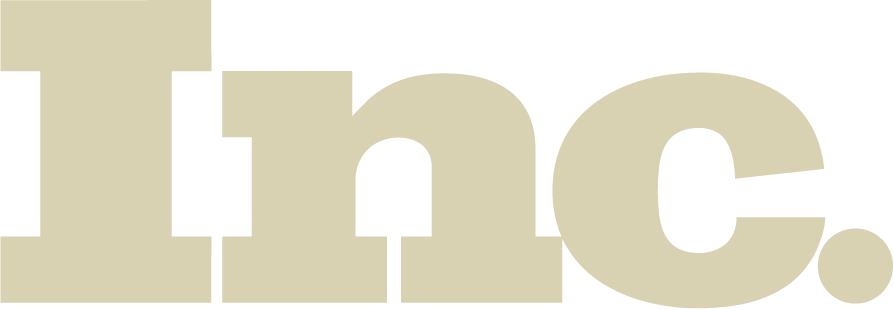 Large, bold, beige letters spelling Inc. on a light gray background.